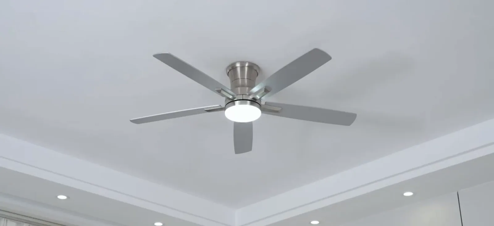 Ceiling with a YUHAO flush-mount fan and its LED light